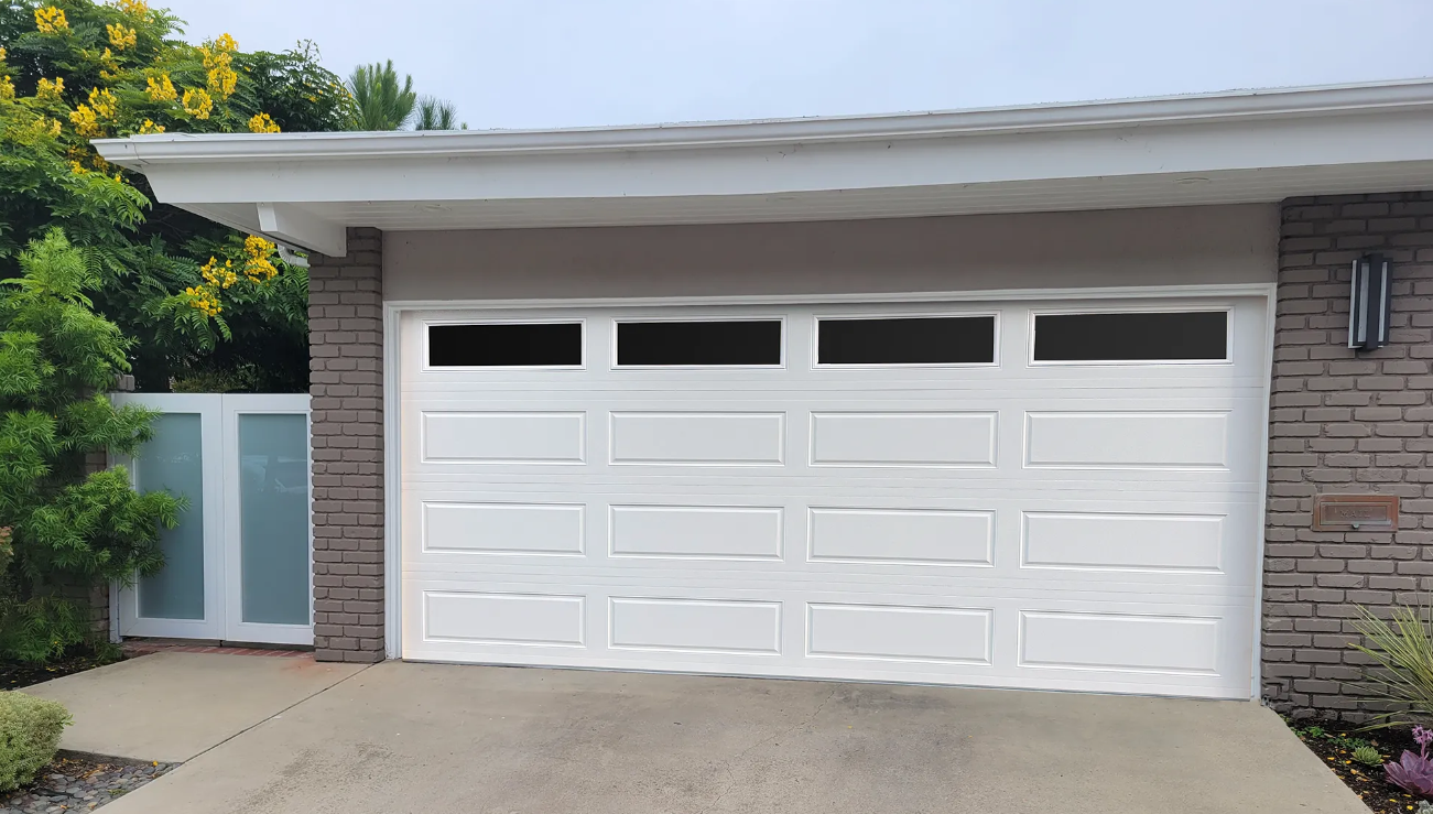 A skilled technician from Garage Door Repair South Miami FL diligently working on a residential garage door. The technician is using specialized tools to ensure efficient and reliable local garage door repair service. The well-maintained garage door in the background highlights the quality of work provided by the South Miami FL team.