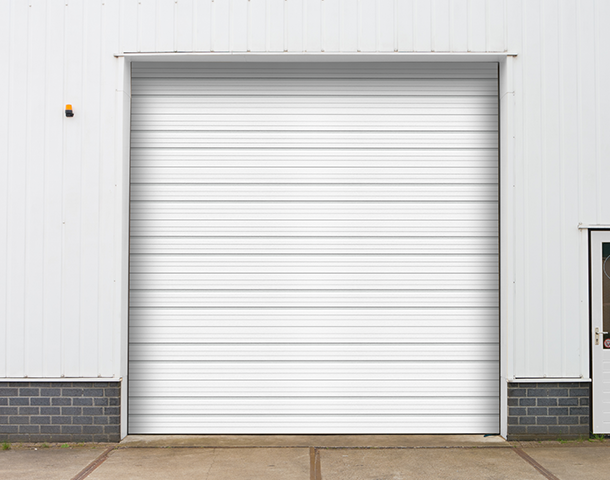 Professional technician carrying out commercial garage door repair in South Miami, FL, ensuring smooth and efficient operation for local businesses.