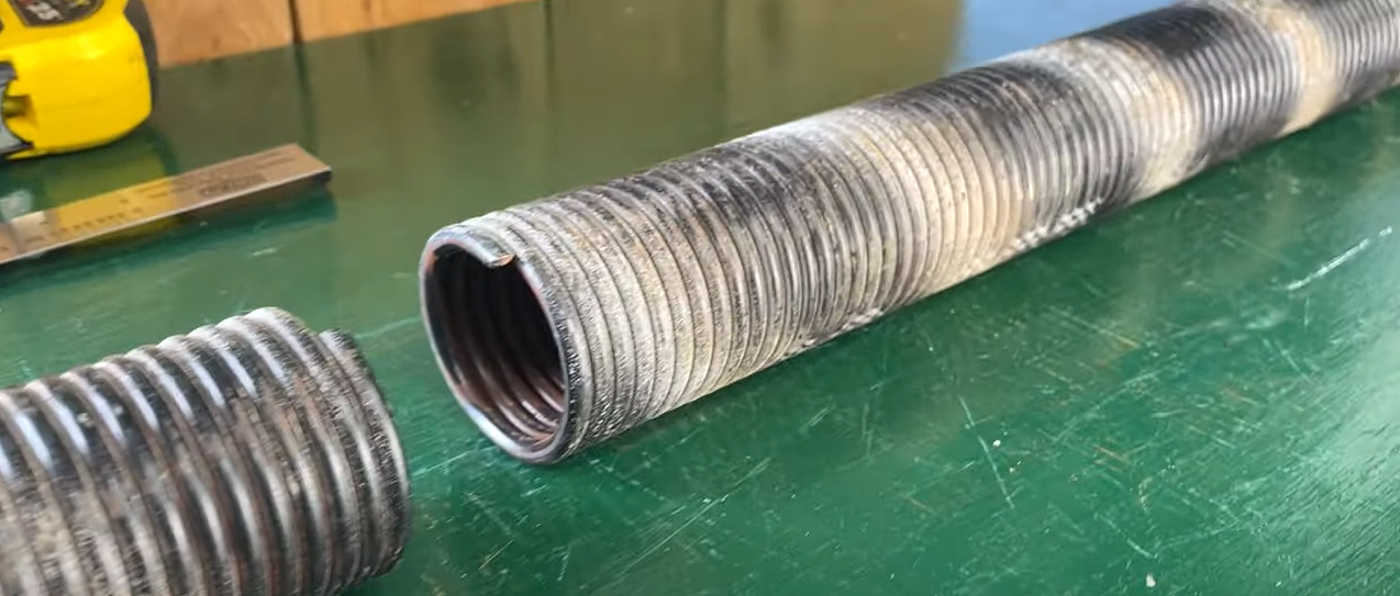 Technician performing garage door spring repair in South Miami, FL, ensuring safety and functionality.