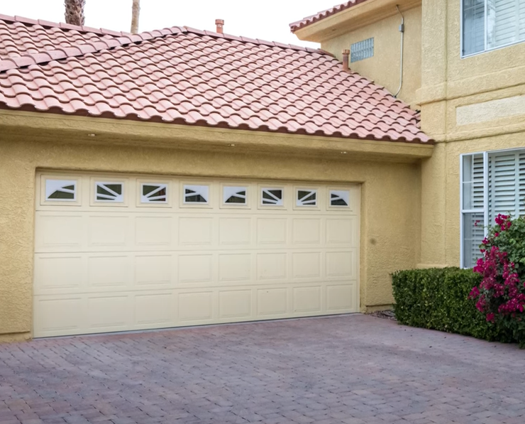 a technician performing garage door section replacement in South Miami, FL, showcasing professional repair services for enhanced security and functionality.