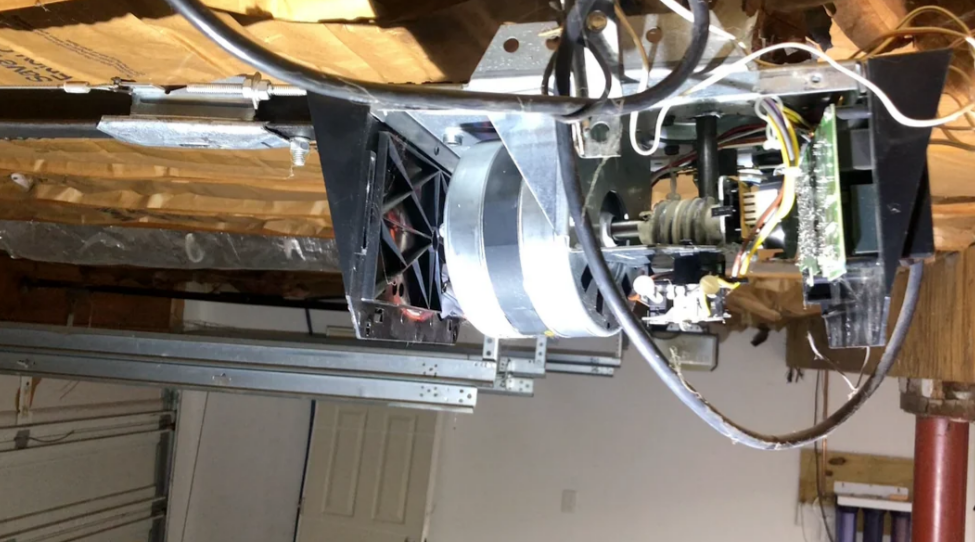 Technician performing garage door opener repair in South Miami, FL, enhancing the reliability of local garage door systems.