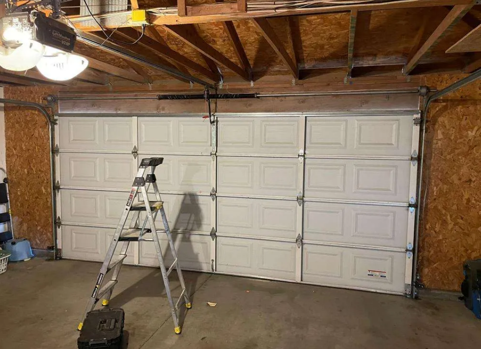 Garage door replacement service in South Miami, FL - Expert technicians installing a new garage door for enhanced security and aesthetics.