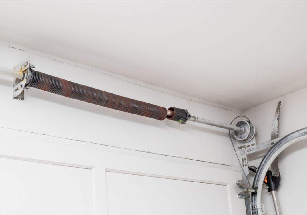 Why a Broken Spring Makes Your Garage Door Feel Heavy