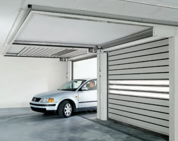 Technician performing overhead garage door repair in South Miami, FL
