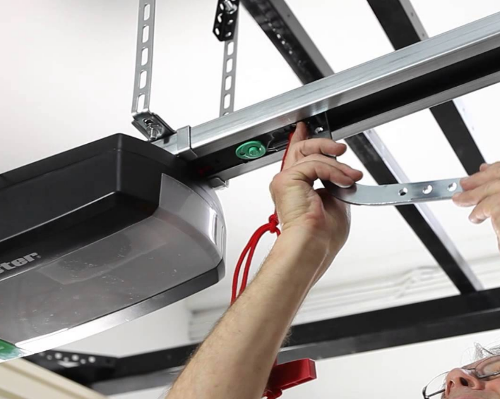 Expert technician fixing a noisy garage door in South Miami, FL using specialized tools for effective repair.